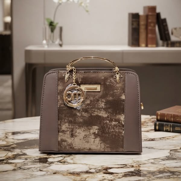 Architectural Taupe Satchel Handbag with Sculptural Gold Handle and Charm