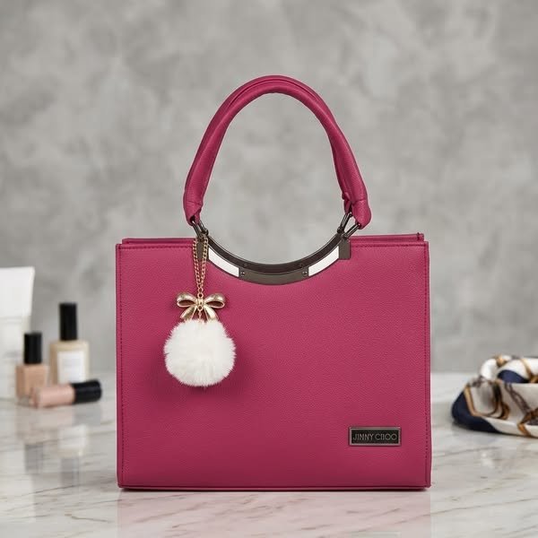 Vivid Magenta Pebble-Grain Structured Satchel with Pom-Pom Charm